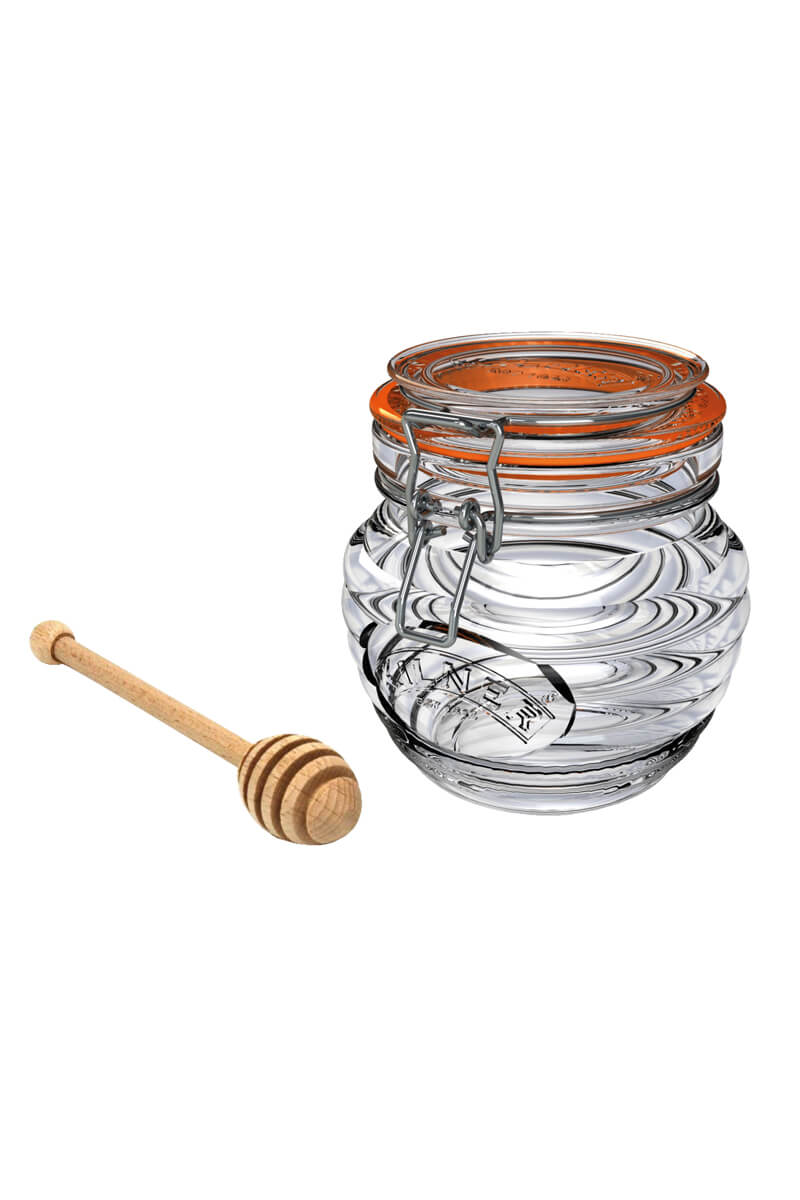 Honig Glas mit Honig Loeffel aus Holz